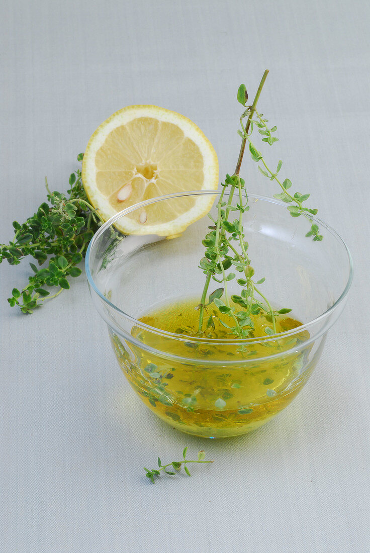 Lemon and thyme dressing in bowl