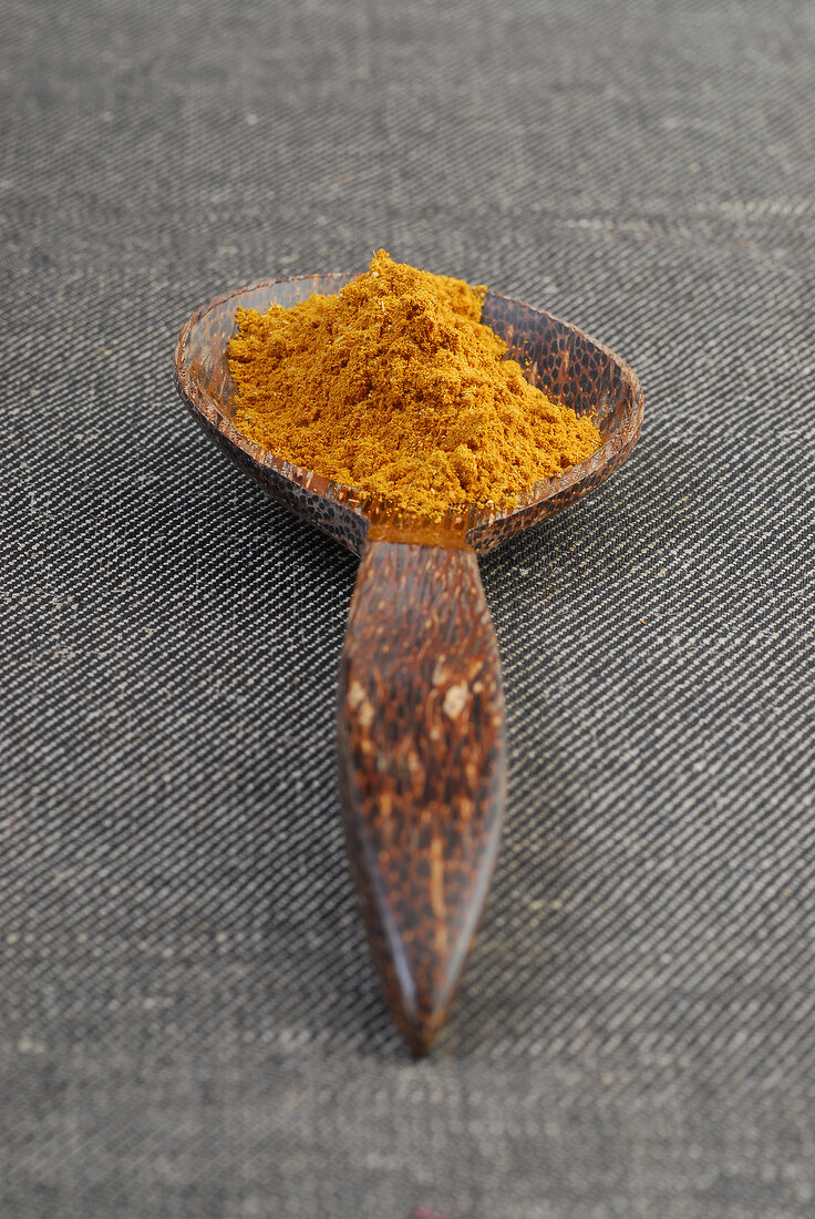 Spice on wooden spoon