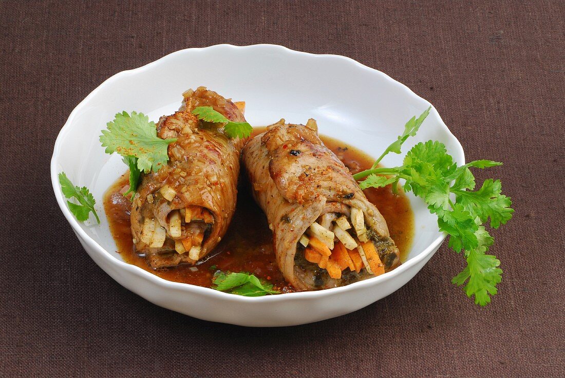 Stir-fried veal rolls with a vegetable filling, coriander and sauce