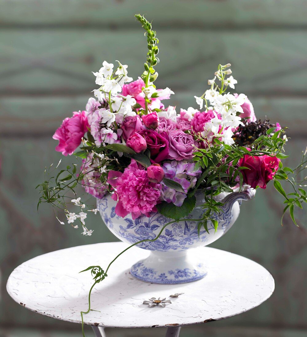 Bouquet of flowers on a white cher iron table