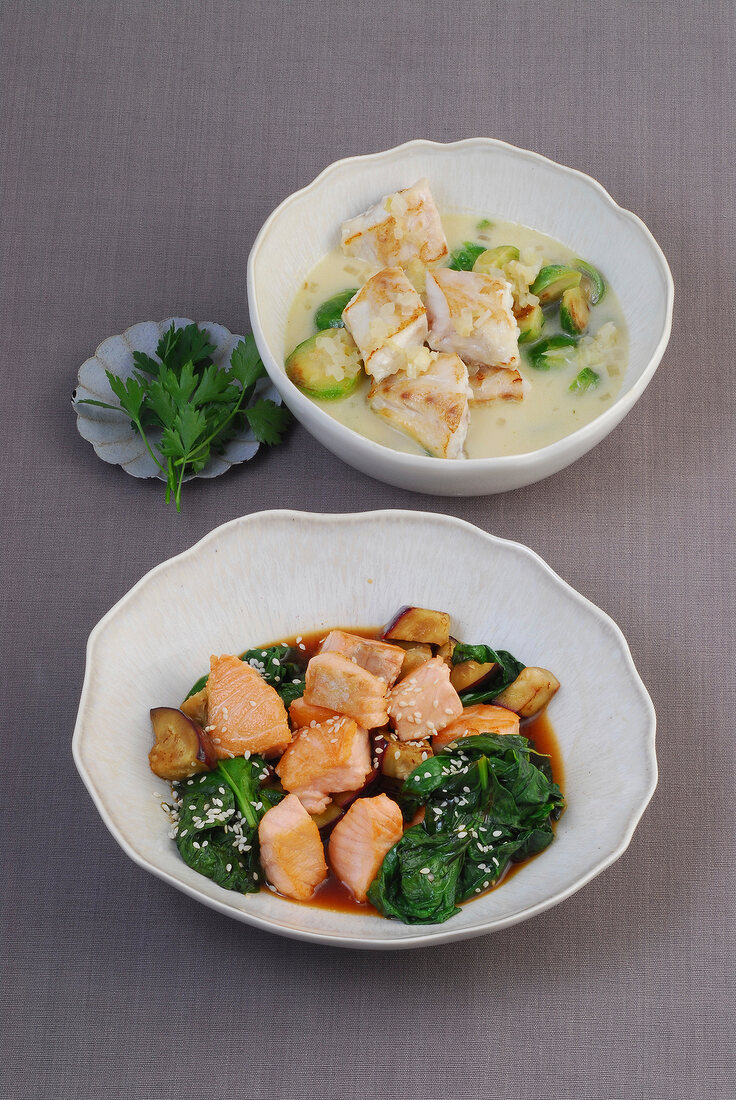 Ginger fish with brussels sprouts and salmon dish in bowls, Japan