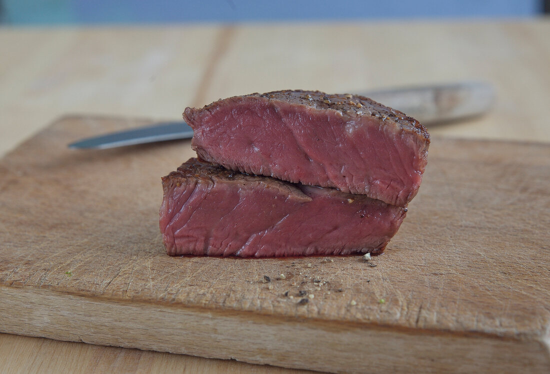 Fried beef steak on wooden board