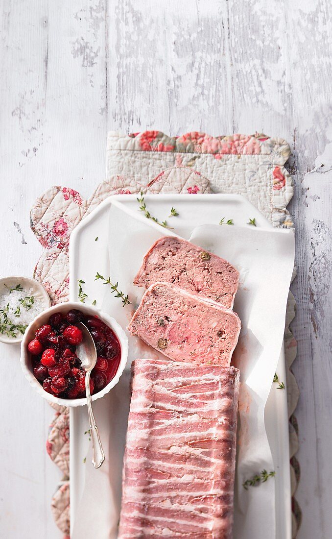 Chicken liver terrine with thyme wrapped in bacon served with cranberries