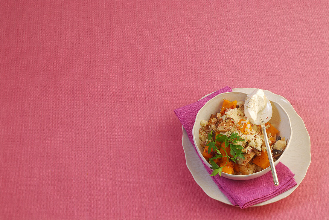 Pumpkin couscous with shiitake in bowl