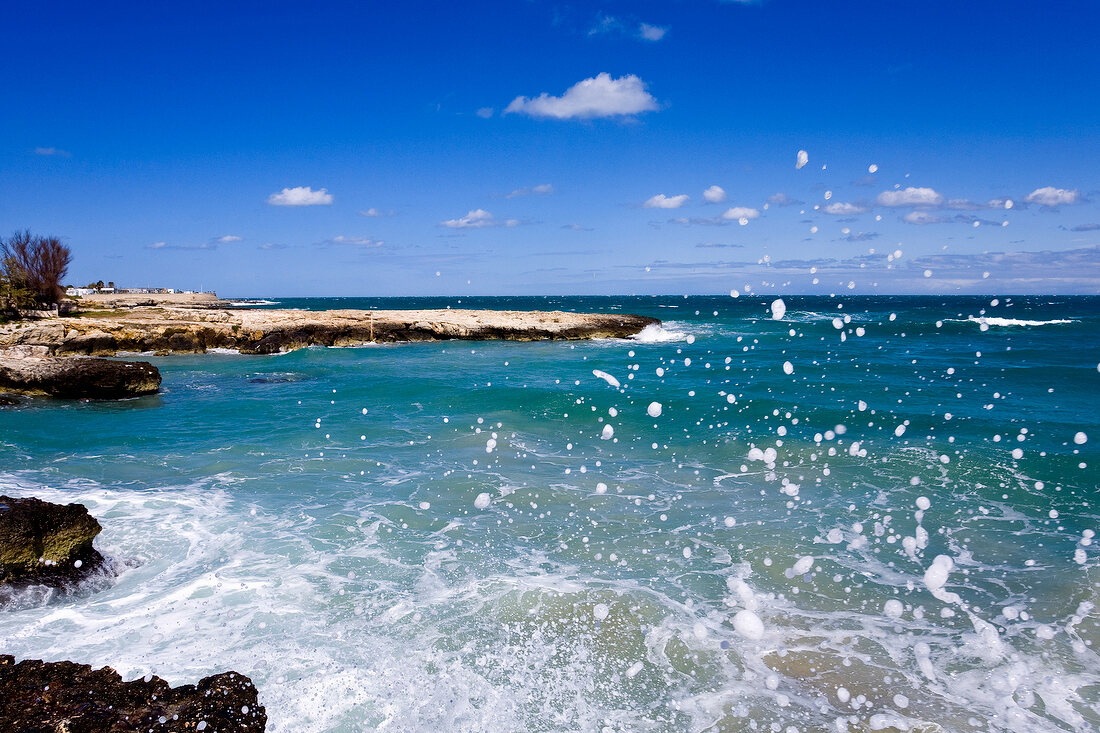 Waves splashing on rocks at coast of Torre Canne, Apulia, Italy