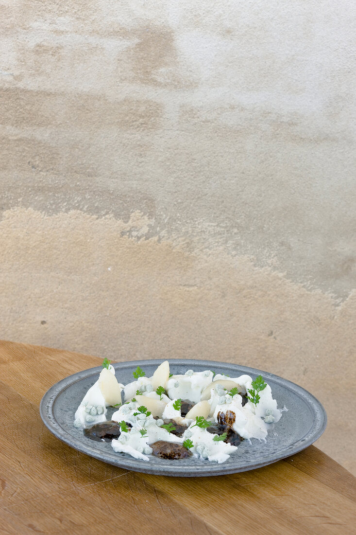 Ice pears with woodruff meringue, sweet licorice, malt oil, sauce and chervil