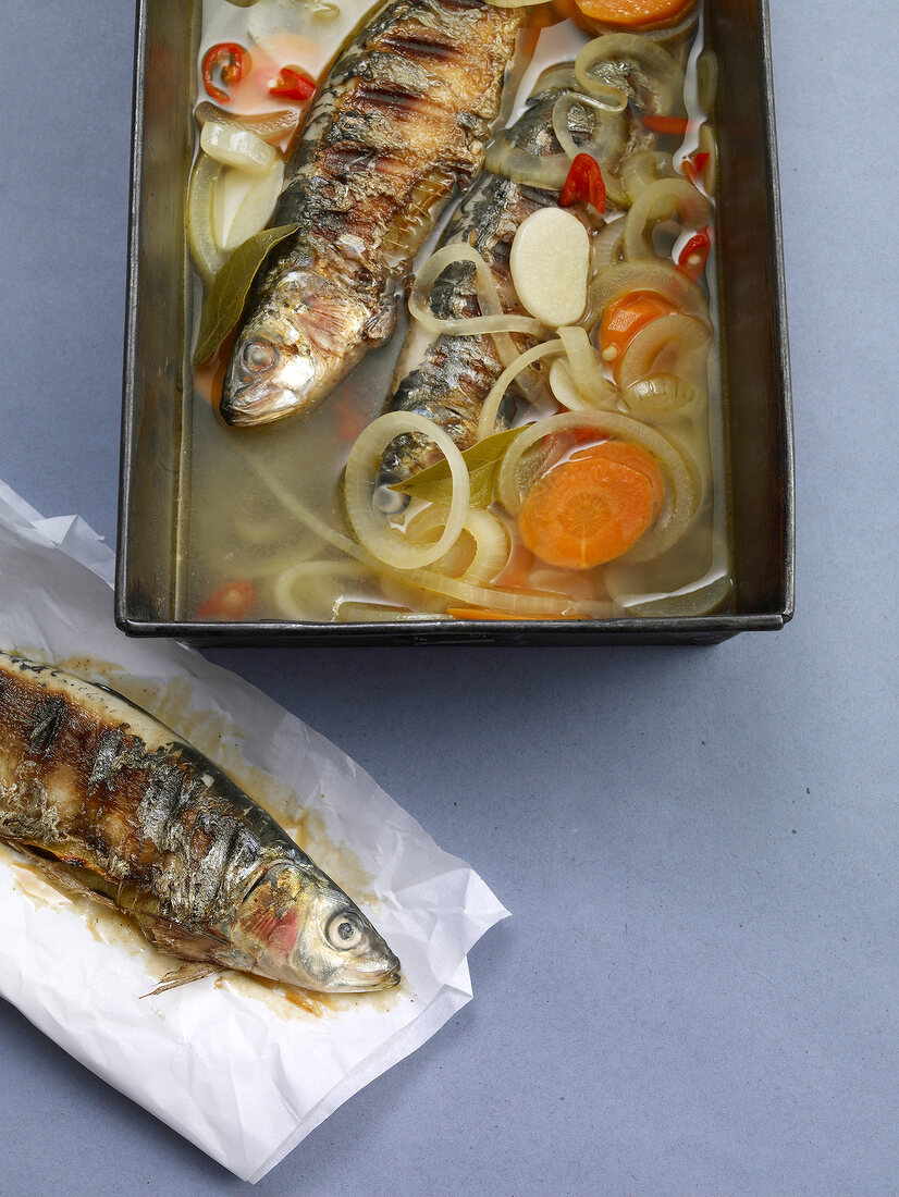 Portuguese style grilled sardines in vegetable soup