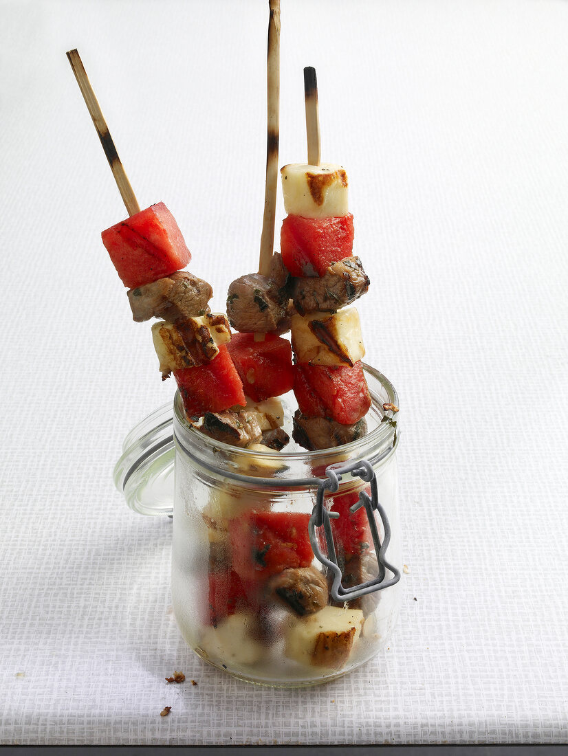 Grilled lamb kebabs with halloumi in glass jar