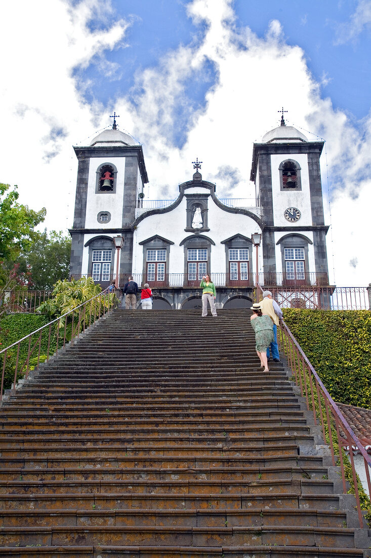Tourists at entrance of Nossa Senhora do Monte church in Funchal, Madeira, Portugal