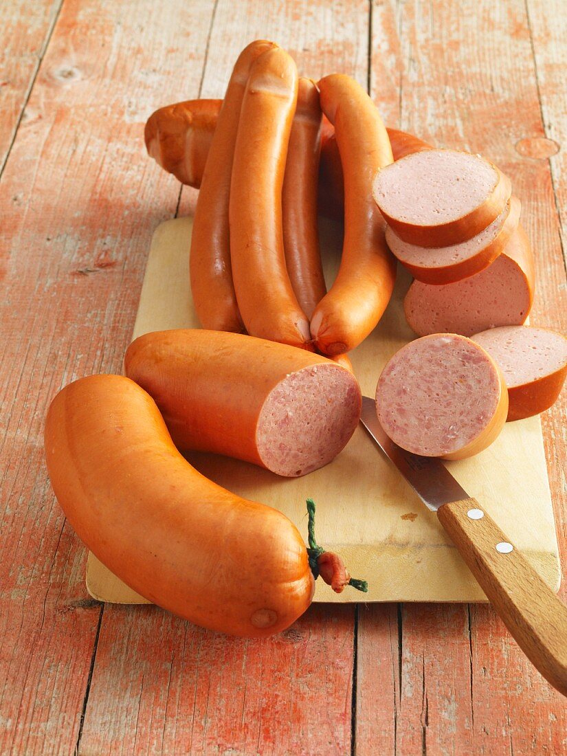 Various sausages on a chopping board