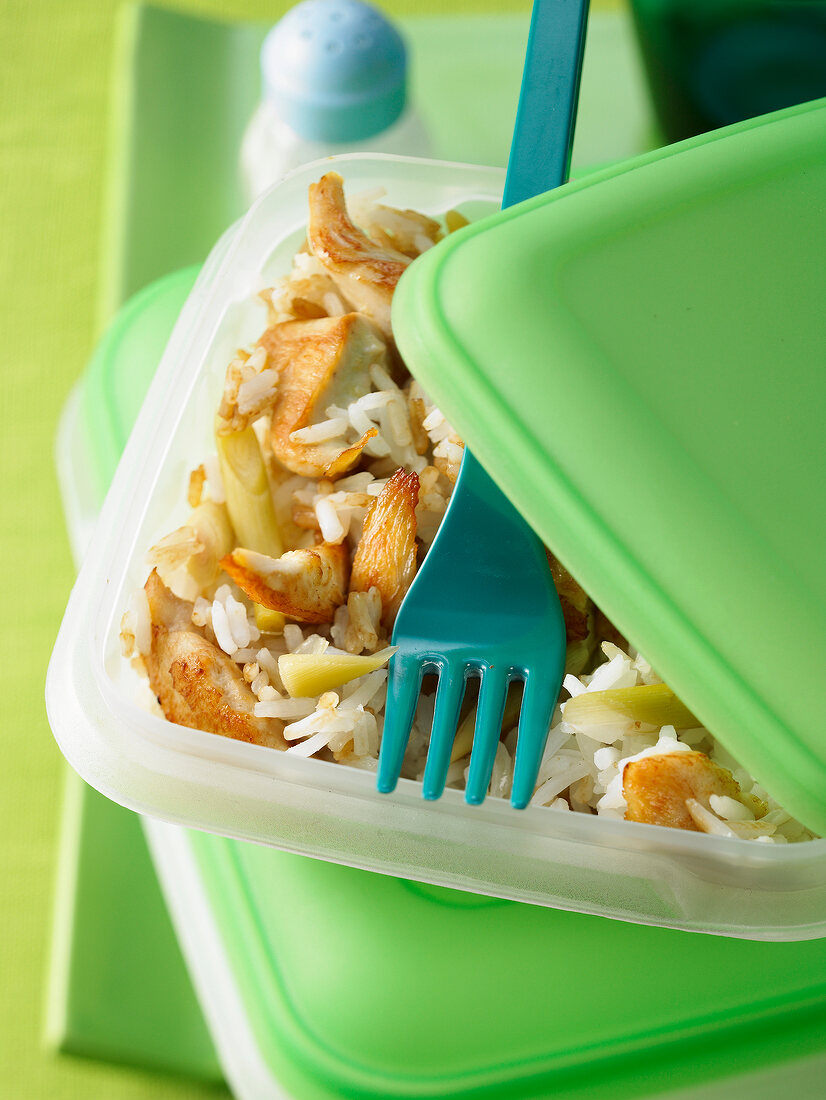 Rice salad with lemongrass and chicken breast strips in Tiffin box