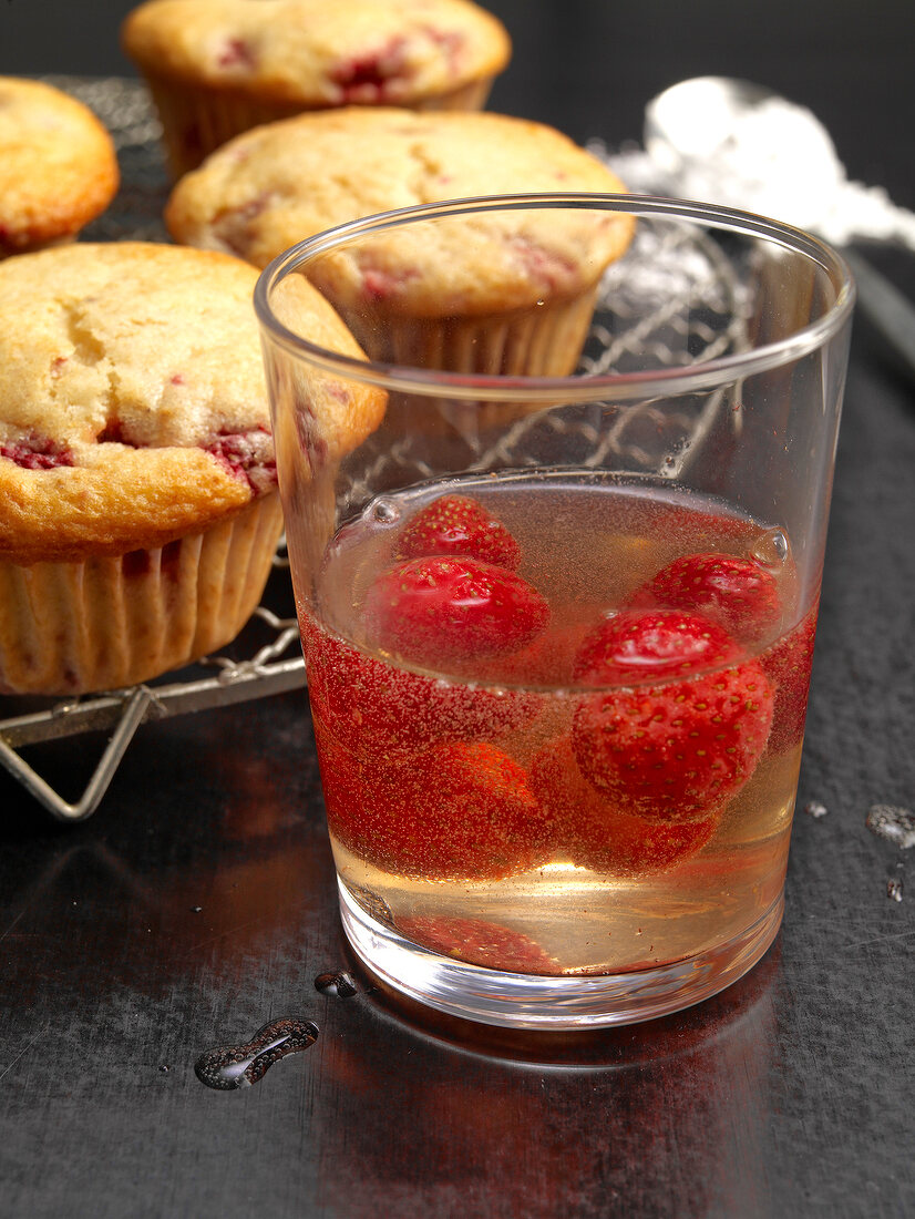 Strawberry muffins with strawberries and prosecco floats in glass