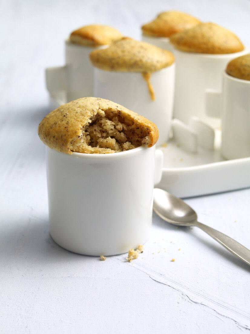 Bamoma muffins with poppy seeds in coffee cup