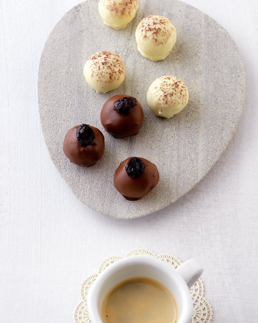 Cappuccino chocolates and coffee marzipan balls on plate