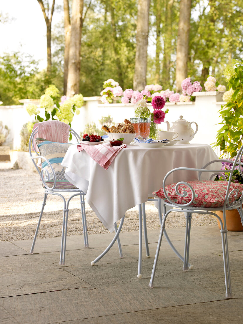 Breakfast table with chair and cover cushion on terrace