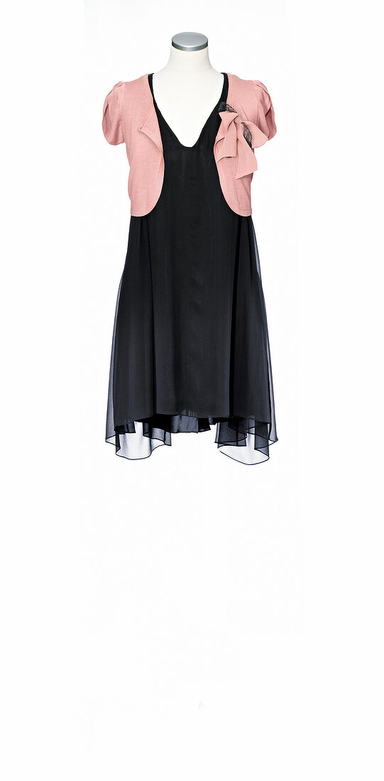 Black silk chiffon dress with pink knit cardigan on mannequin