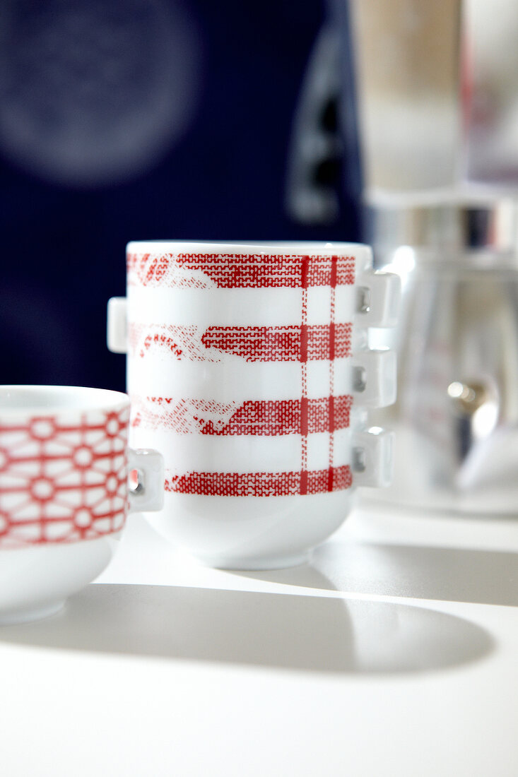 Red and white cups with lace pattern