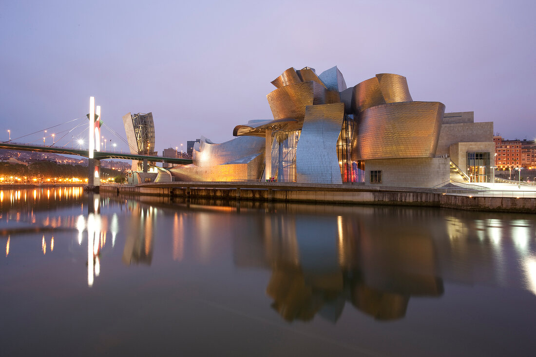 View of Guggenheim Museum on Nervion River at evening, Bilbao, Basque Country, Spain