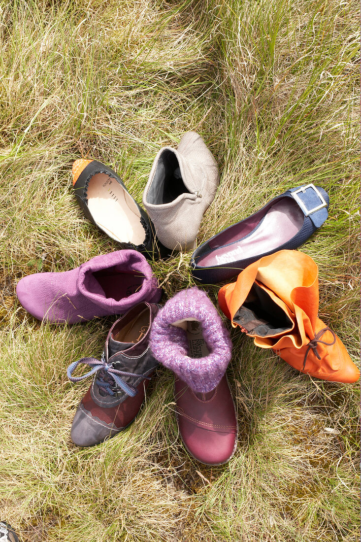 Seven different types of shoes in grass