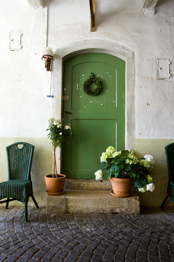 Green door of Munster gallery in Kallmunz, Regensburg, Bavaria, Germany