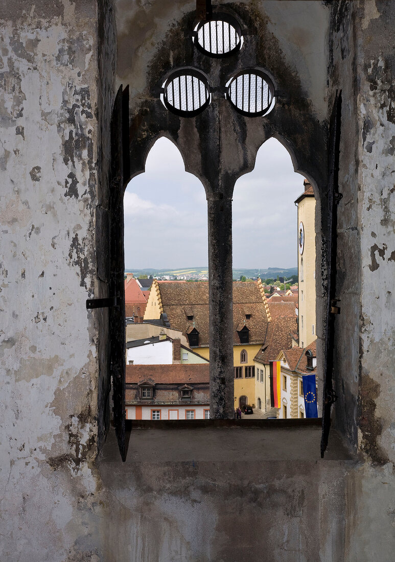 View of houses through window of Baumburger Tower in Regensburg, Germany