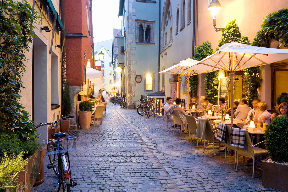 People sitting in outdoors cafe, Regensburg, Bavaria, Germany