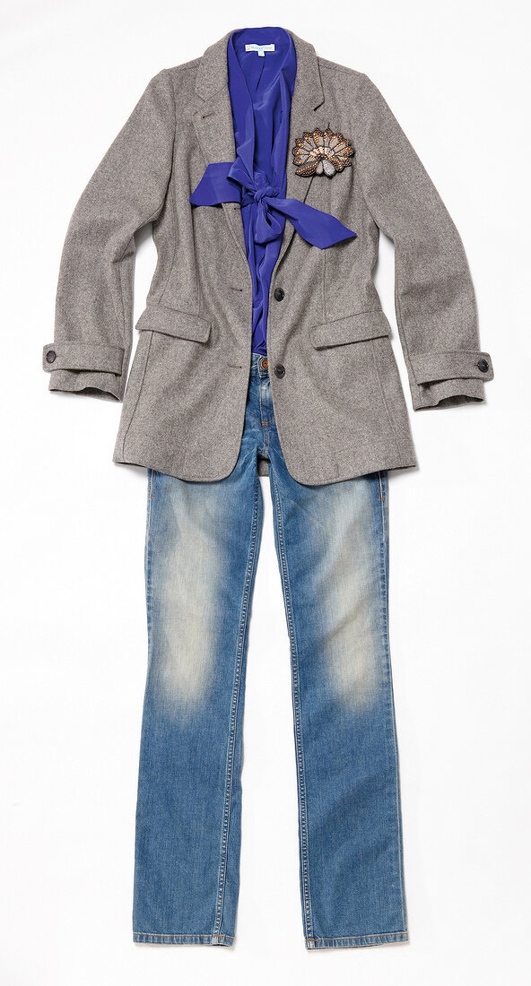 Blue blouse with grey blazer and jeans on white background