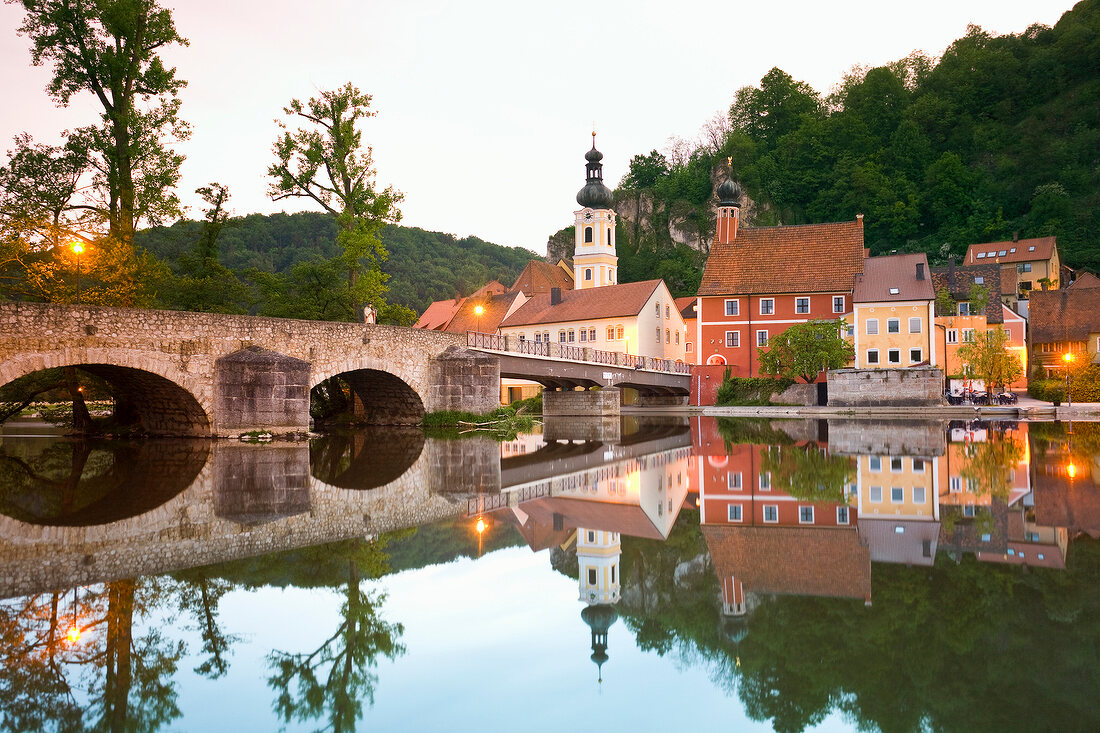 View of bridge, Naab river and medieval village of Kallmunz, Bavaria, Germany