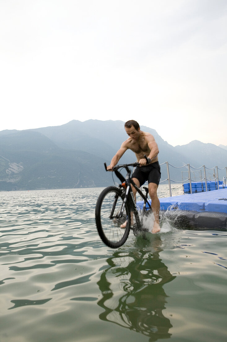 Man riding mountain bike in Lake Garda, Italy