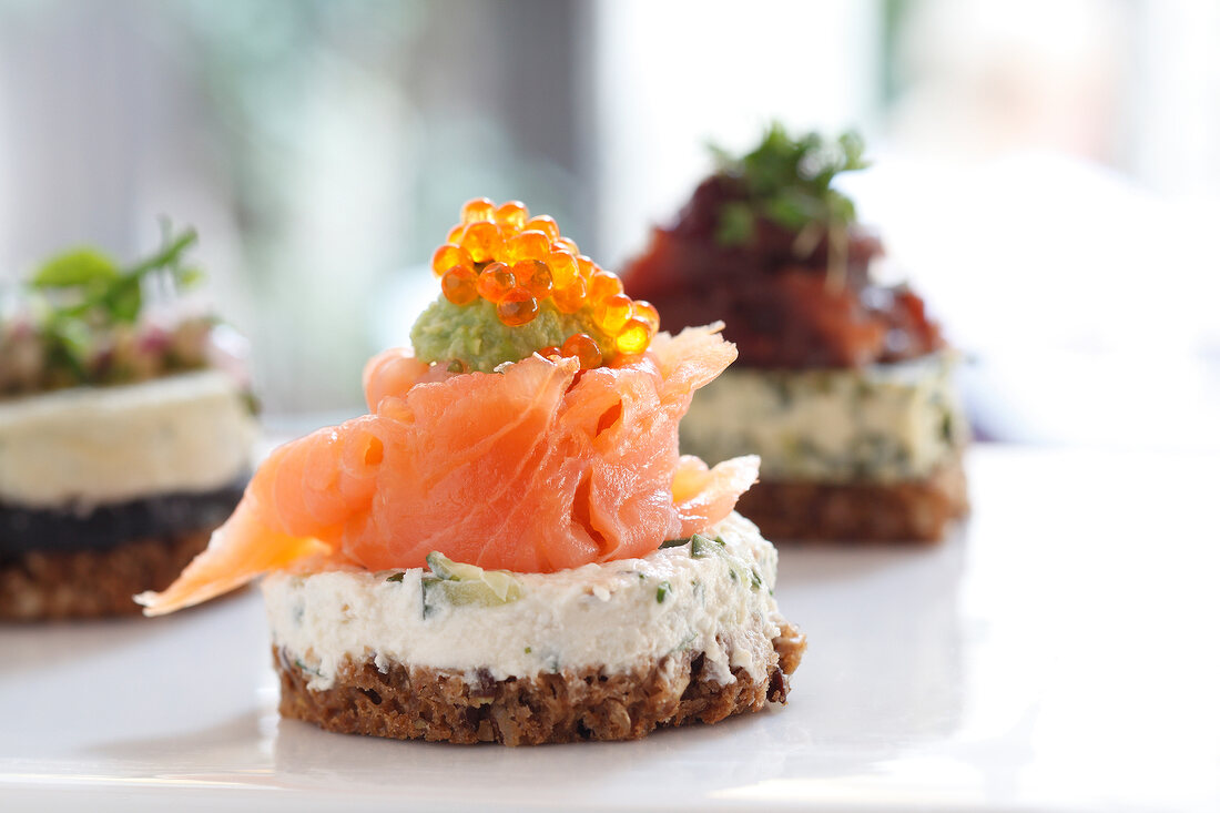 Close-up of salmon Sushi made of bread, cream cheese, salmon and caviar