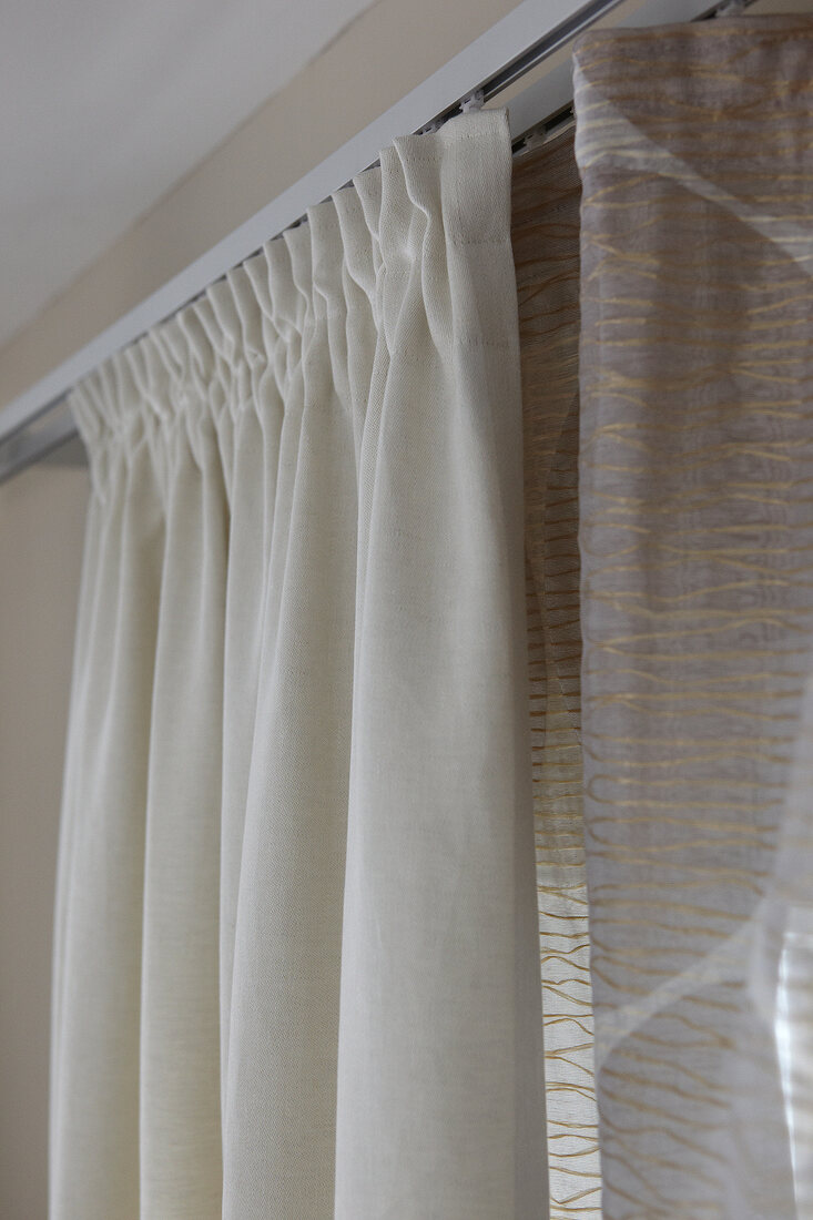 Close-up of beige and brown curtains