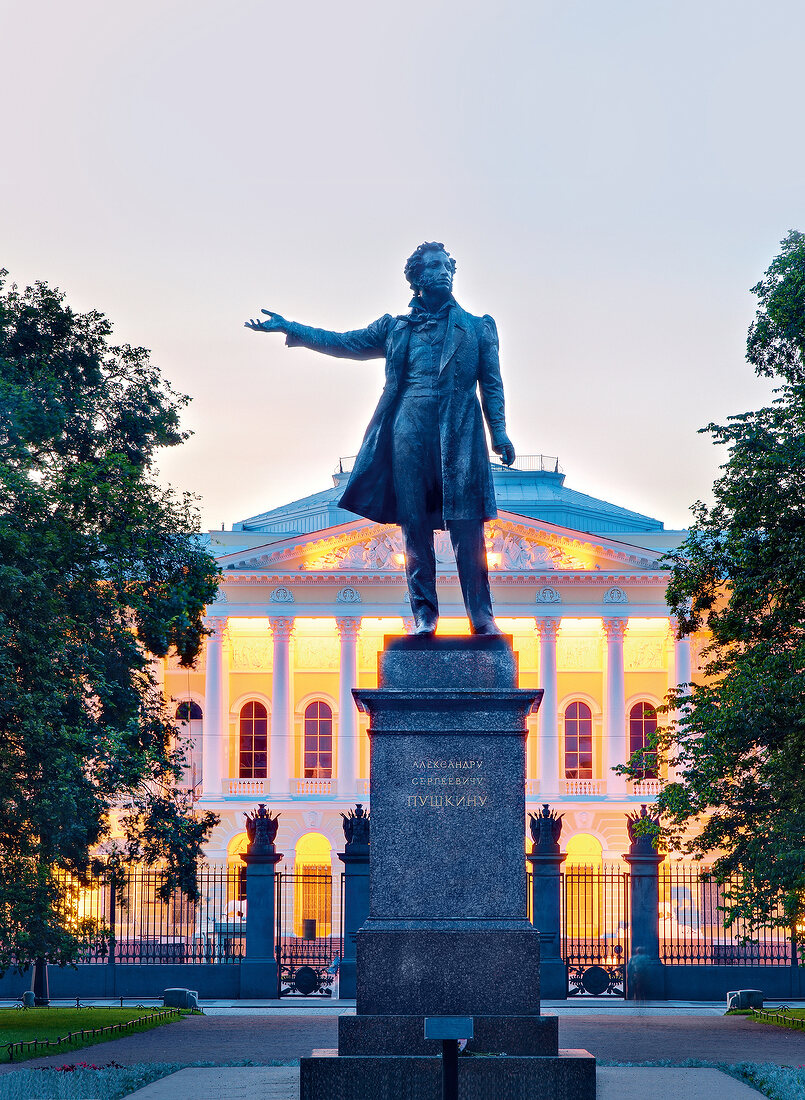 Statue and facade of Pushkin Memorial Museum at dusk in Saint Petersburg, Russia