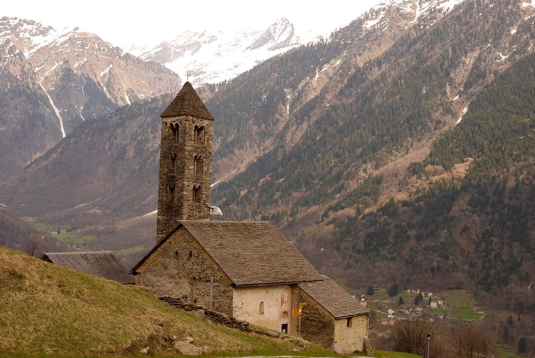 View of mountain range and San Carlo Church in Ticino, Switzerland