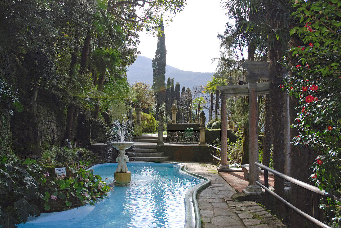 Trees and fountain at Parco Scherrer Morcote, Ticino, Switzerland