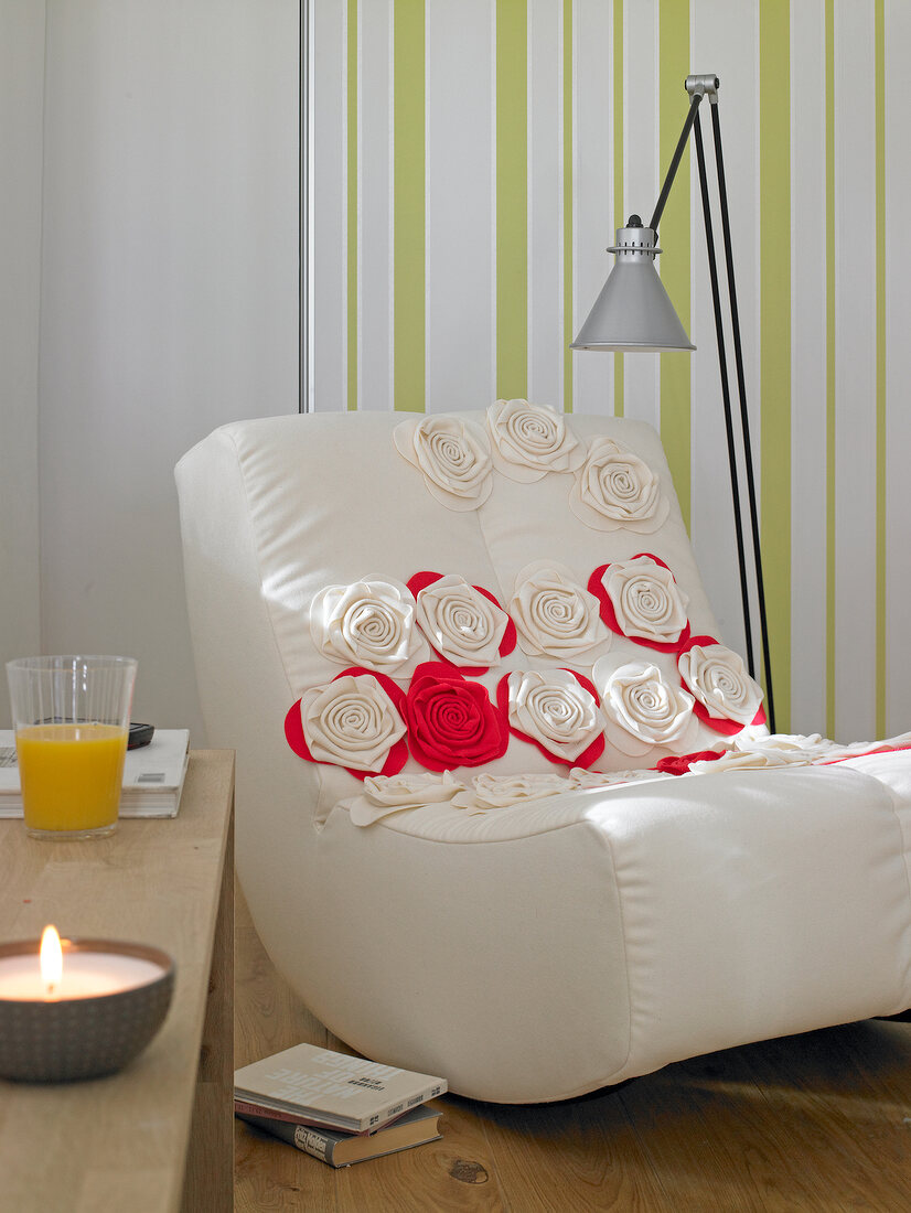 White swing chair with fabric roses
