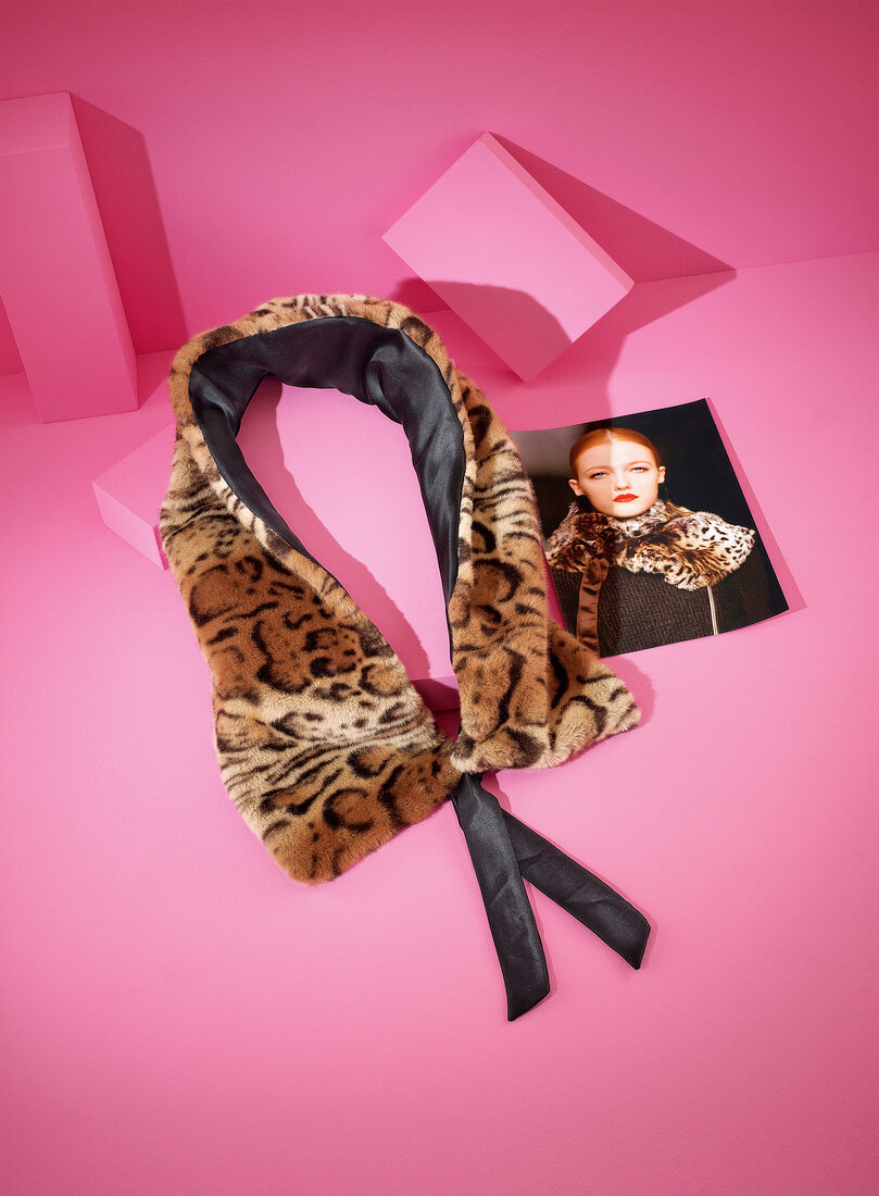 Animal printed plush scarf with photo on pink background