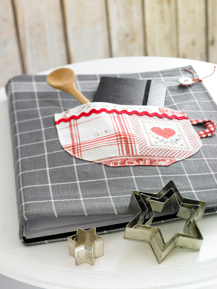 Close-up of recipe book with gray plaid fabric cover