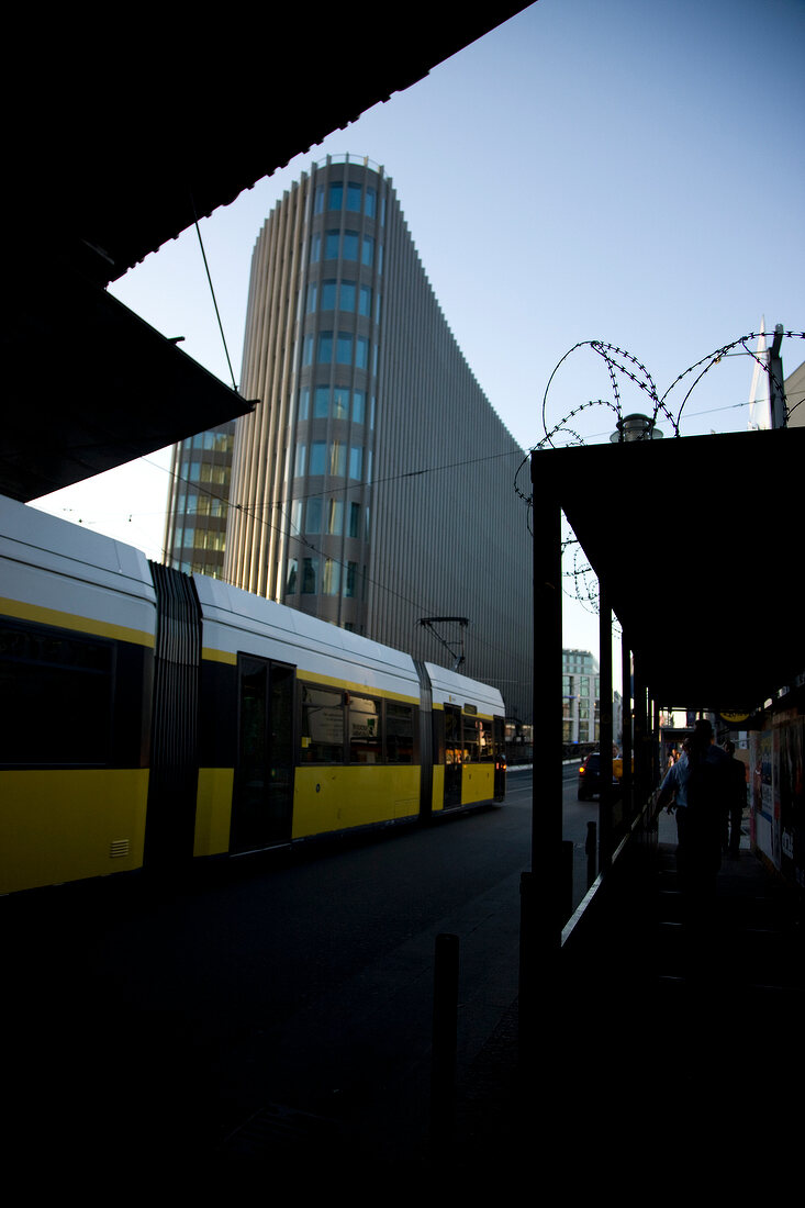 Tram station with skyscraper in background, Friedrichstrasse, Berlin, Germany