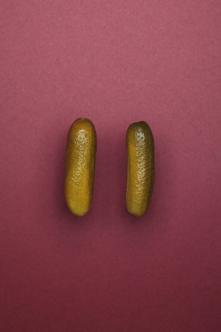 Spreewald cucumber on maroon background – License image – 10226887 ❘ Image  Professionals