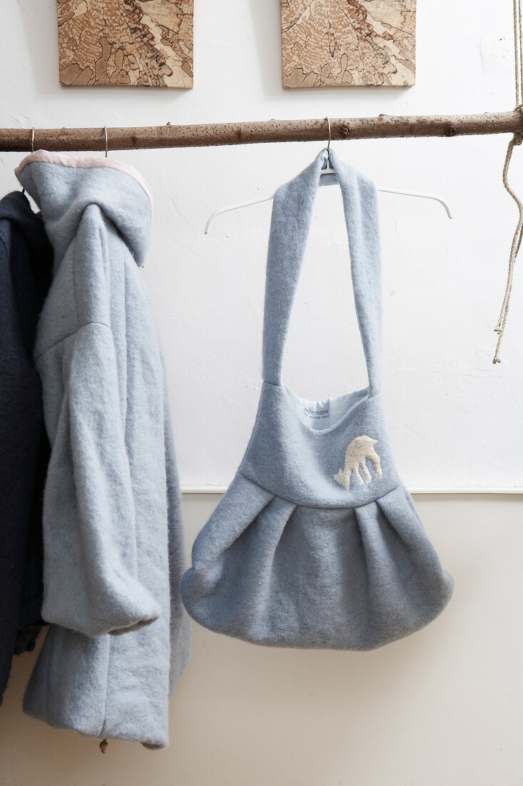 Gray handbag of wool with animal print hanging