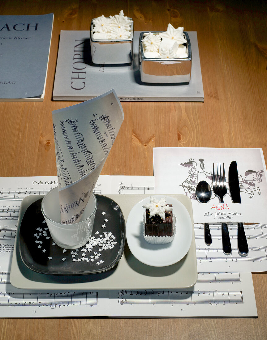 Porcelain tray with plate, sugar stars, cutlery and music notes
