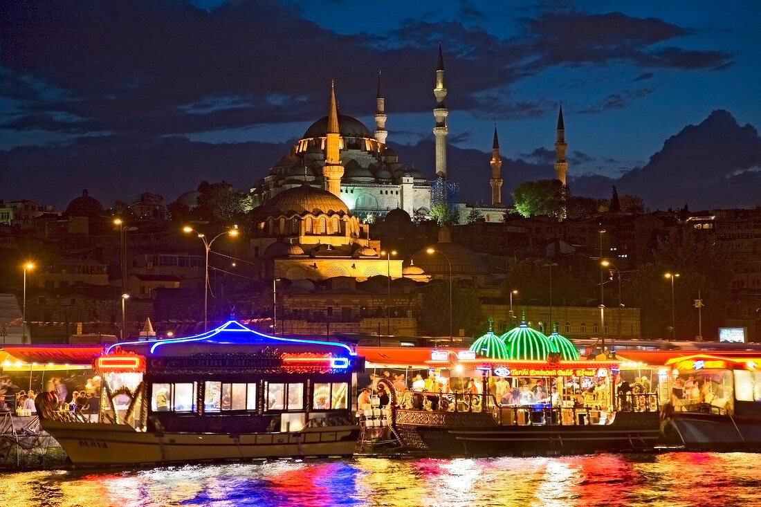 View of illuminated Suleymaniye mosque at night in Bosphorus at Istanbul, Turkey