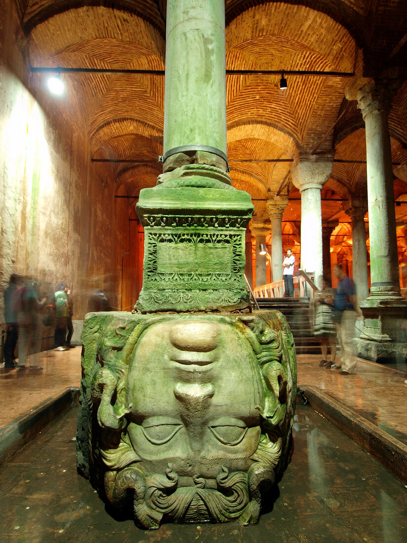 Enormous Basilica Cistern Medusa head pillar in water, Istanbul, Turkey