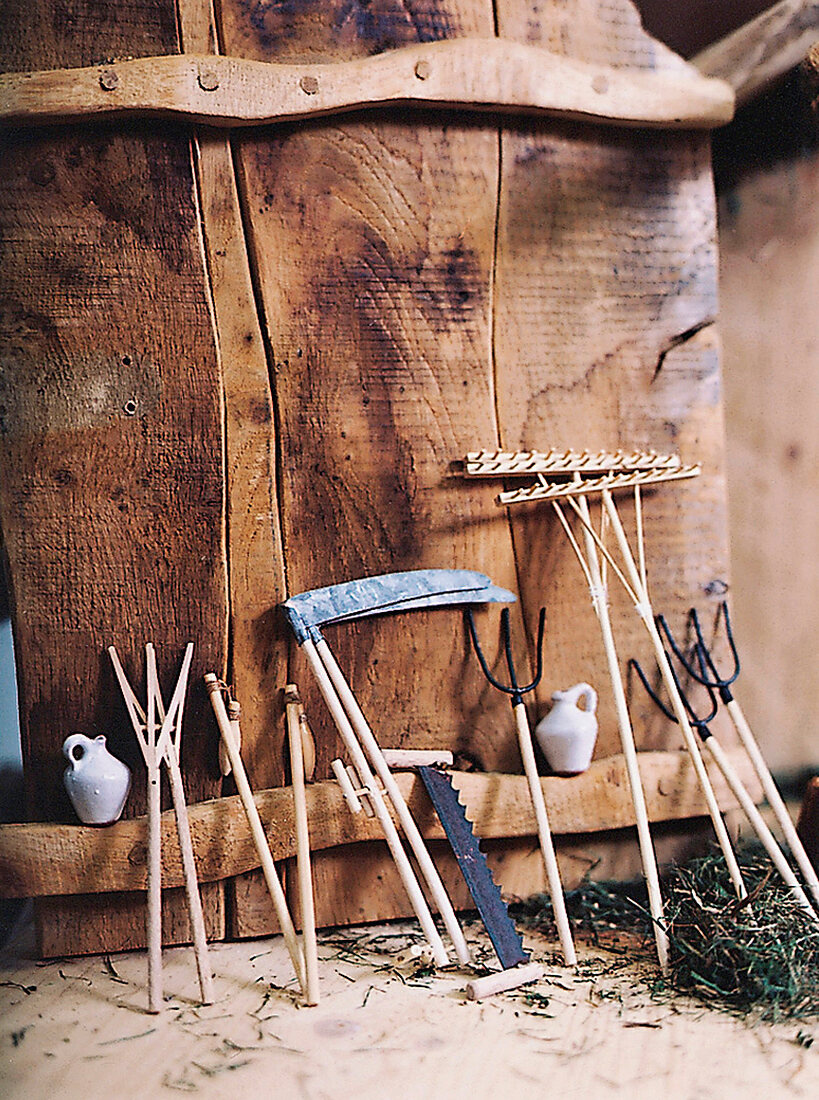 Gardening tools on wooden wall