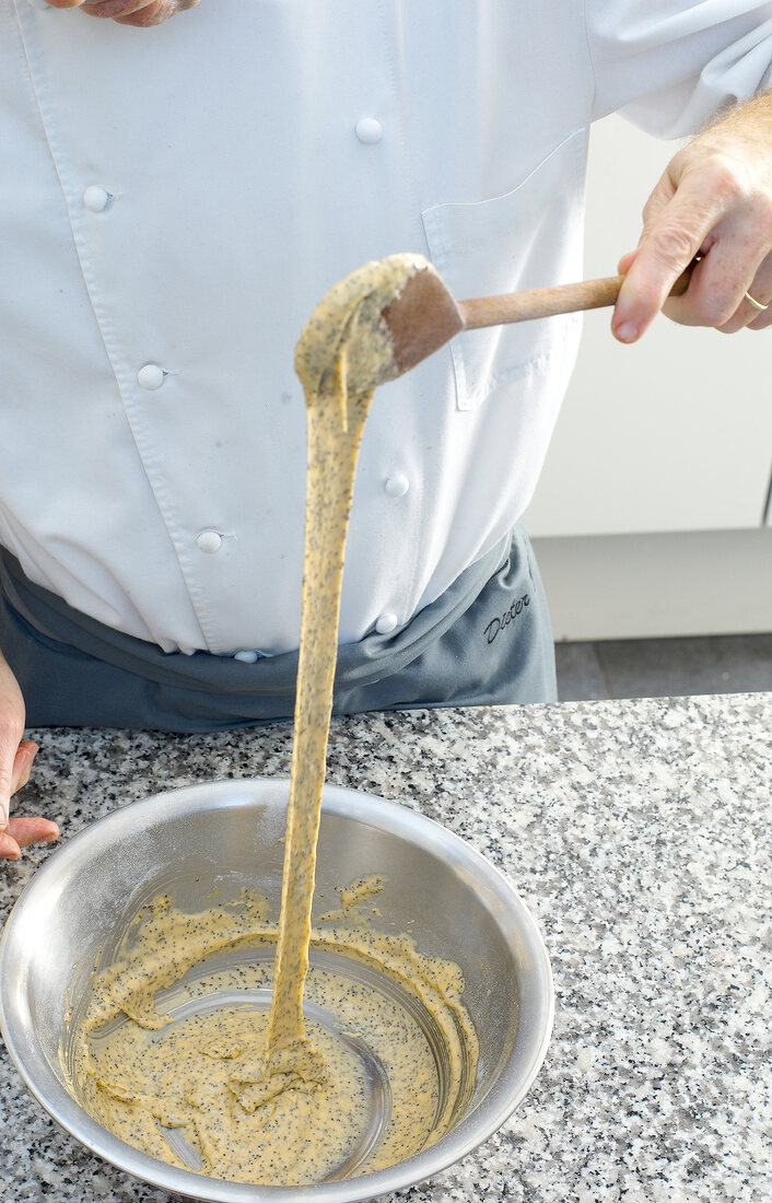 Mixing ingredients for poppy spaetzle in bowl