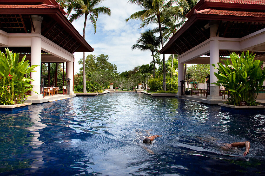 View of banyan tree villas pool palms located in luxury hotel in Phuket, Thailand