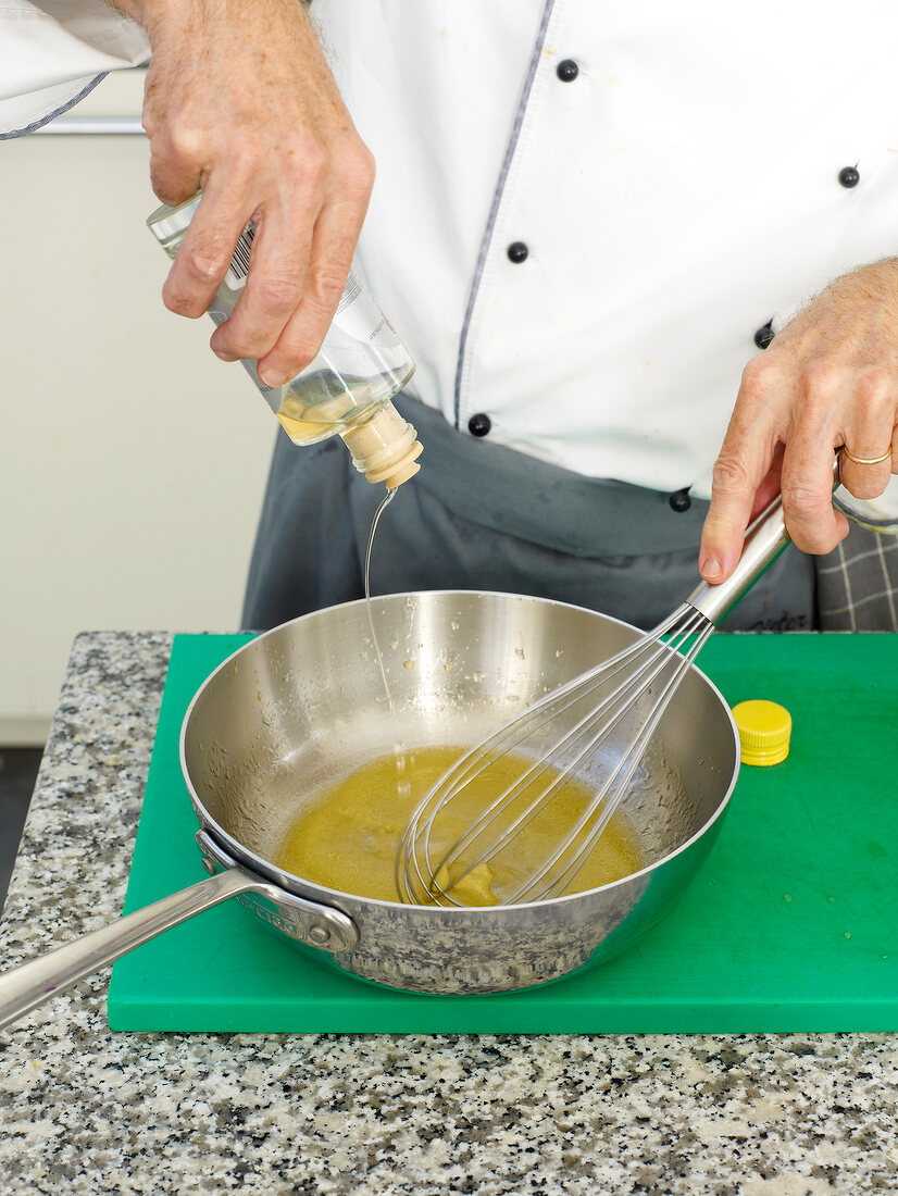 Adding olive oil to lime juice in saucepan