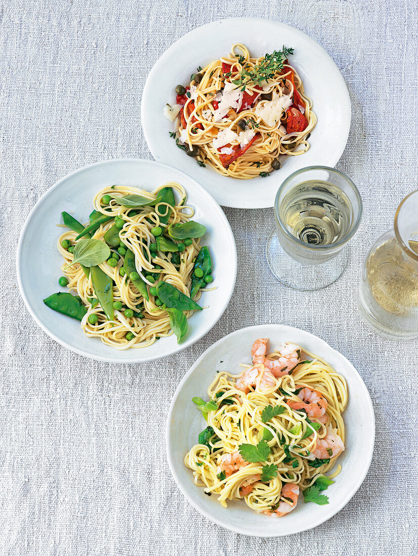 Three different pasta with linguine on plates