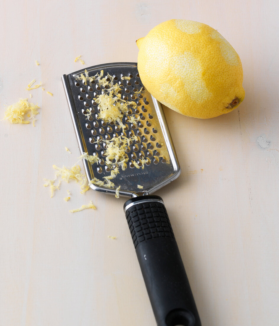 Grated lemon and lemon zest on grater