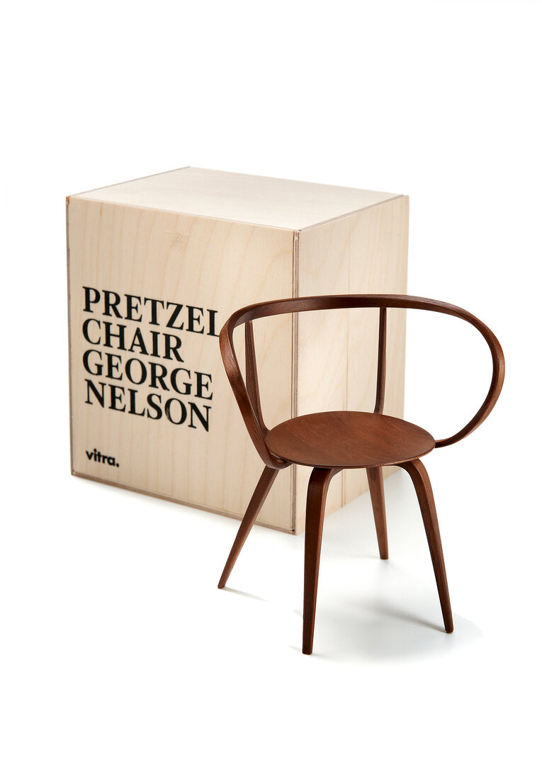 Pretzel chair against box on white background